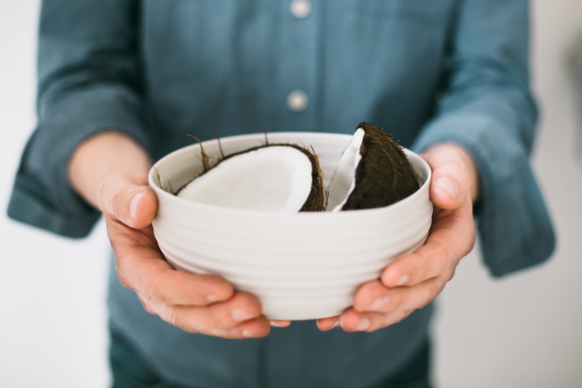 Halved coconut in a bowl